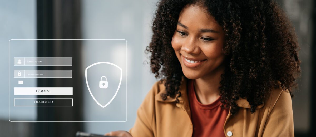 A young woman smiling as she uses a tablet, with a digital security interface overlay showing a login and registration form.