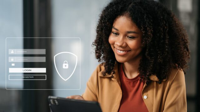 A young woman smiling as she uses a tablet, with a digital security interface overlay showing a login and registration form.